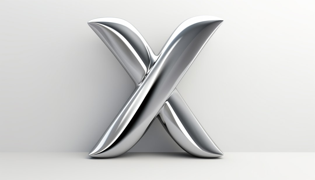 A shiny, metallic letter "X" stands upright against a plain, light gray background, casting a soft shadow on the surface below.